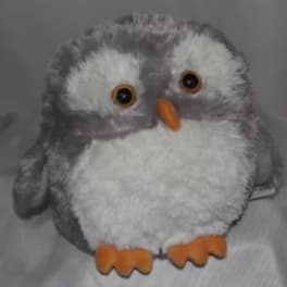 Plush gray-and-white owl toy with orange beak and feet