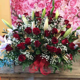 Large bouquet of red roses and white lilies with baby's breath