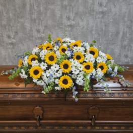 Sunflower and white daisy casket spray with blue accents