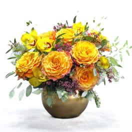 Yellow and orange rose bouquet in a gold vase