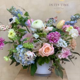 Mixed pastel bouquet in a white vase