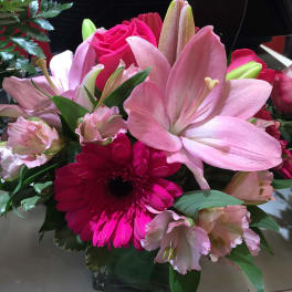 Pink lilies and gerbera daisies in a mixed bouquet