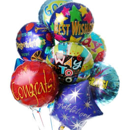 Bouquet of colorful foil balloons with congratulatory and best wishes messages