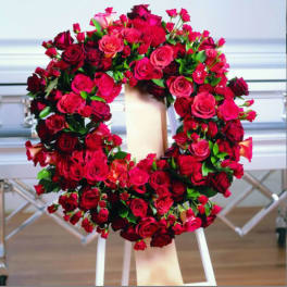 Large red rose wreath on a standing easel