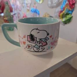 Ceramic mug with a Snoopy heart design and teal handle