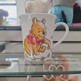 White mug with a Winnie the Pooh illustration