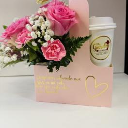 Pink roses and carnations in a gift box with a coffee cup