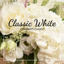 White rose bouquet with pale blooms and green accents