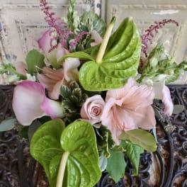 Pink and green bouquet with calla lilies, anthuriums, and roses