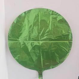 Round green foil balloon against a white background
