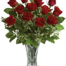 Bouquet of red roses in a clear glass vase