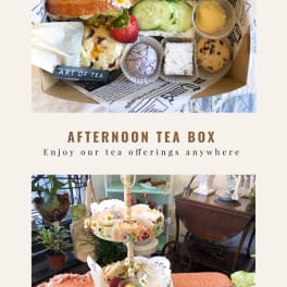 Afternoon tea box and tiered stand with assorted sandwiches, pastries, fruit, and small flower garnishes.