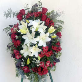 Standing floral spray with white lilies and red roses