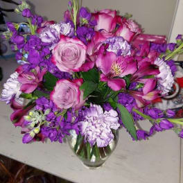 Pink and purple bouquet in a glass vase