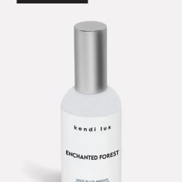 Bottle of scented room spray with a silver cap