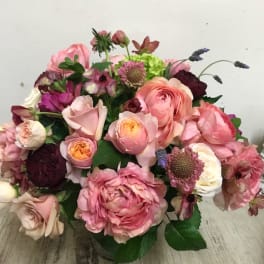 Bouquet of pink and burgundy flowers in a vase