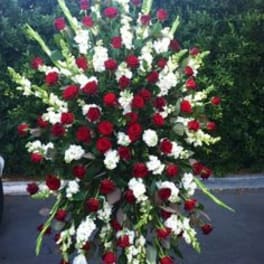Large standing spray of red and white flowers