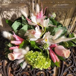Bouquet of pale pink roses, white orchids, and green hydrangea