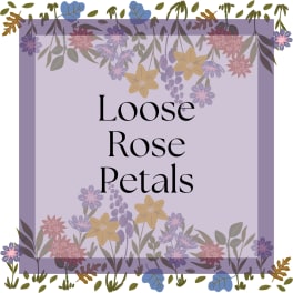 Decorative sign reading Loose Rose Petals with floral border