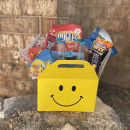 Yellow smiley-face gift box filled with candy and small soda bottles