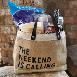 Gift tote filled with snacks and a bottle of wine