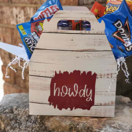 Wooden gift box with assorted snack bags and candy