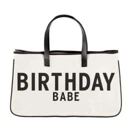 White tote bag with black handles and the words BIRTHDAY BABE