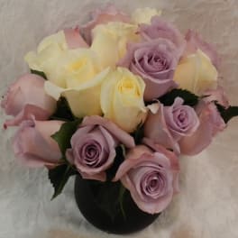 Bouquet of pastel roses in a black vase