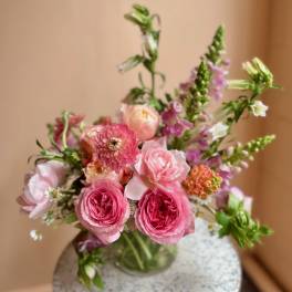 Pink mixed bouquet in a clear glass vase