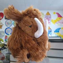 Brown plush mammoth toy with white tusks