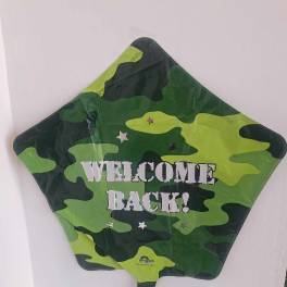 Camouflage star-shaped balloon with "WELCOME BACK!" text