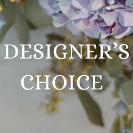 Lavender hydrangea blooms with small yellow accents and the words "Designer’s Choice"