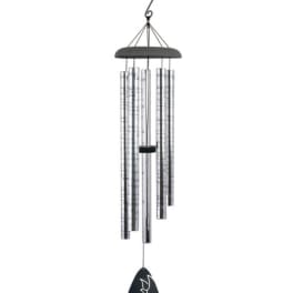Silver wind chime with hanging tubes and a black dove pendant