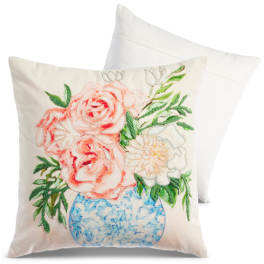 Decorative pillow with painted pink and white flowers in a blue vase
