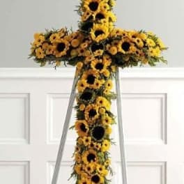 Sunflower cross arrangement on a standing easel