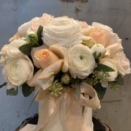 Cream and blush bouquet in a white hatbox with a ribbon