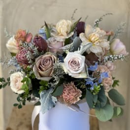 Mixed pastel bouquet in a white round box