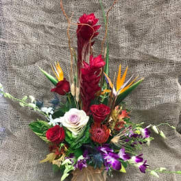Tropical bouquet with red roses and purple orchids