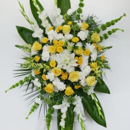 Standing floral spray with yellow and white flowers