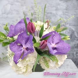 Purple orchids and white hydrangeas in a bouquet