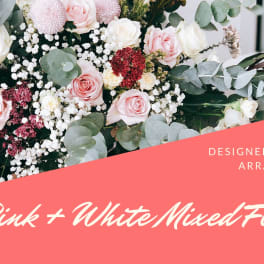 Pink and white mixed flower arrangement with roses and round blooms