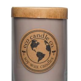 Soy wax candle in a glass jar with a kraft paper lid