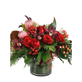 Red roses and burgundy orchids in a glass vase