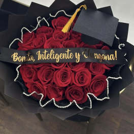 Bouquet of red roses with a graduation cap and gold tassel