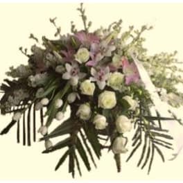 Large bouquet of white and pink flowers with trailing greenery