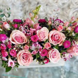 Pink rose bouquet with small magenta flowers and mixed greenery