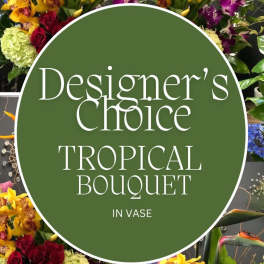 Designer’s choice tropical bouquet in a vase with orchids and roses