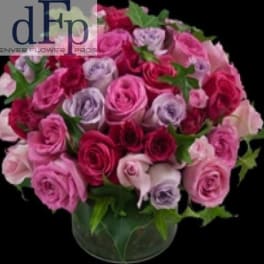 Bouquet of pink and lavender roses in a glass vase