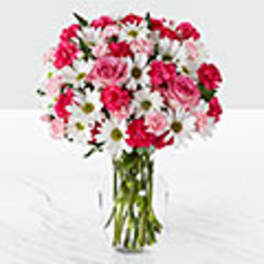 Pink and white mixed bouquet in a clear glass vase
