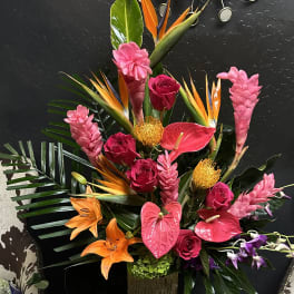 Tropical arrangement with pink roses, anthuriums, lilies, and bird-of-paradise